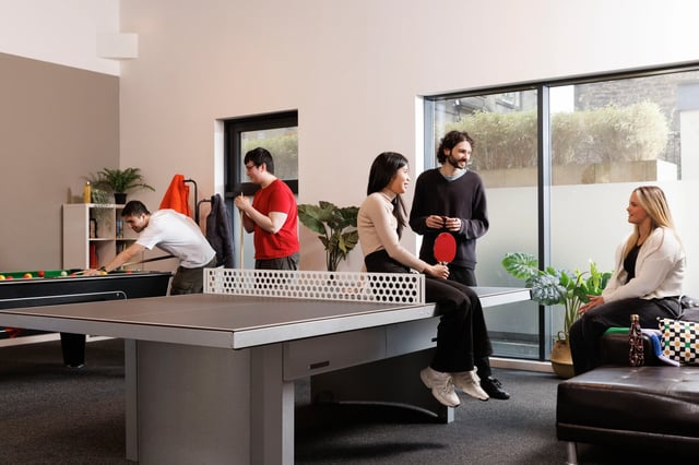People playing billiards and table tennis recreation room at Shrubhill House in Edinburgh Student Accommodation