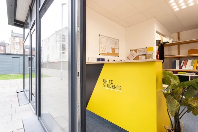 Reception desk with Unite Students branding reception area at Murano House in Edinburgh Student Accommodation
