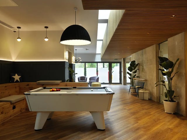 Pool table plants and seating area living room at Student Castle Bath in Bath Student Accommodation