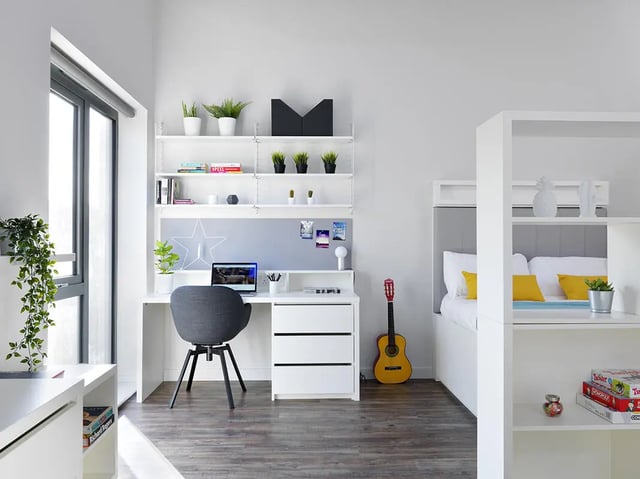 Desk chair laptop shelves guitar bed bedroom at Student Castle Bath in Bath Student Accommodation