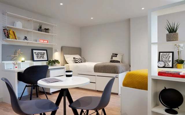 Bed desk and seating area bedroom at Student Castle Durham in Durham Student Accommodation