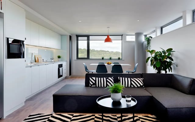 Modern kitchen dining living area with sectional sofa at Student Castle Durham in Durham Student Accommodation