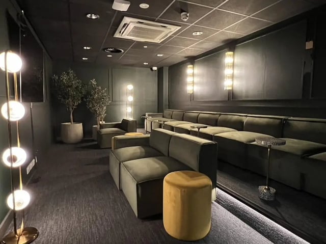 Modular sofas plants and tall lamp lounge area at Student Castle Reading (New Century Place) in Reading Student Accommodation