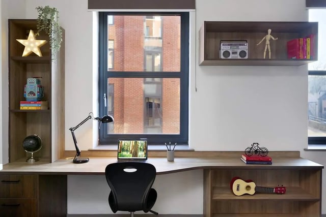 Desk with laptop chair and shelves Study area at Student Castle Reading (New Century Place) in Reading Student Accommodation
