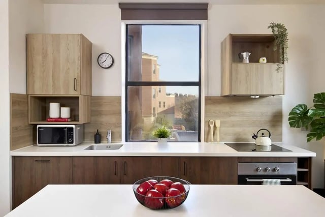 Microwave kettle stovetop fruit bowl kitchen at Student Castle Reading (New Century Place) in Reading Student Accommodation