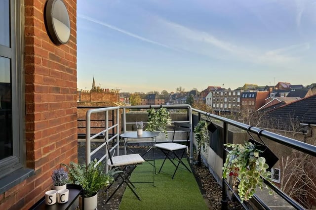 Table chairs plants on balcony exterior at Student Castle Reading (New Century Place) in Reading Student Accommodation