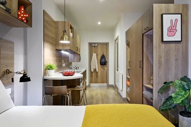 Bed kitchen doorway wardrobe student studio at Student Castle Reading (New Century Place) in Reading Student Accommodation
