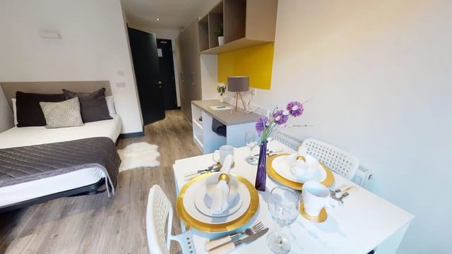Bed table and kitchen counter studio apartment at Opto village in Luton Student Accommodation