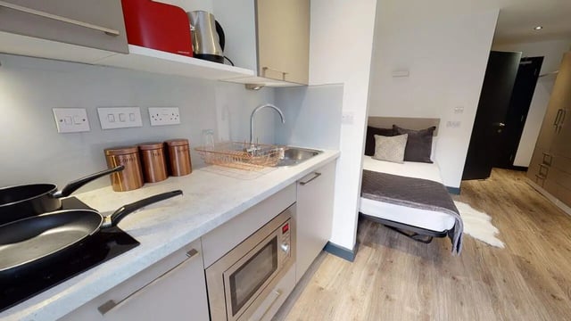 Kitchenette with bed and wardrobe studio at Opto village in Luton Student Accommodation