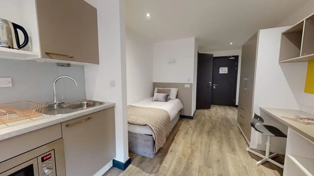 Bed, sink, kettle, desk, wardrobe bedroom at Opto village in Luton Student Accommodation