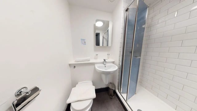 Toilet sink and shower with tiled walls bathroom at Chapel Street - Luton in Luton Student Accommodation