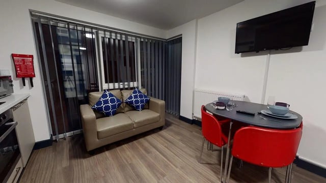 Sofa dining table television living room at Chapel Street - Luton in Luton Student Accommodation