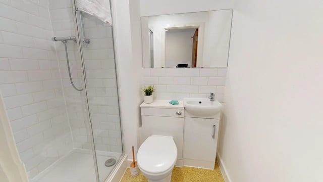 Shower toilet sink and mirror bathroom at Park House in Luton Student Accommodation