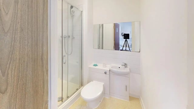 Toilet sink shower mirror reflected camera bathroom at Park House in Luton Student Accommodation