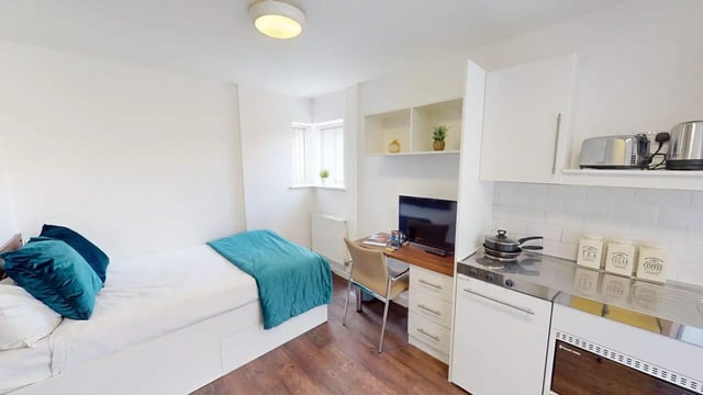 Bed desk kitchen appliances and toaster studio apartment at Park House in Luton Student Accommodation