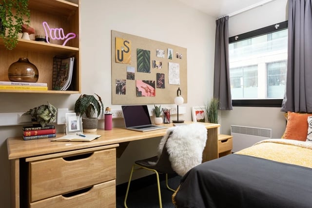 Desk with laptop and bed bedroom at Rosalind Franklin Halls in Portsmouth Student Accommodation