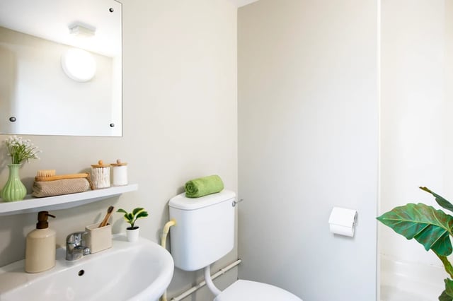 Sink toilet roll dispenser and mirror bathroom at Margaret Rule Hall in Portsmouth Student Accommodation