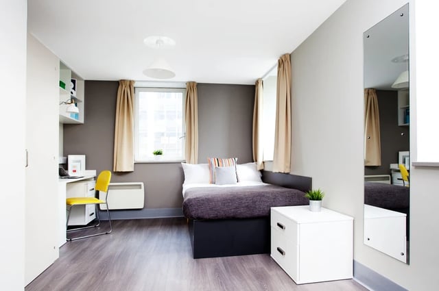Bed desk and shelves student bedroom at Margaret Rule Hall in Portsmouth Student Accommodation