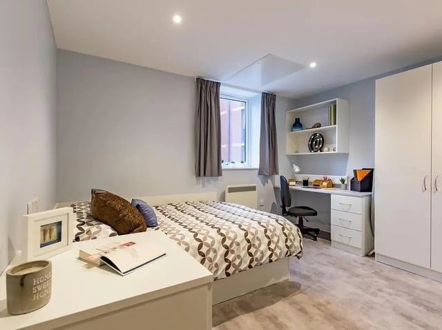 Bed desk wardrobe shelving and chair bedroom at Mary Parker House in Plymouth Student Accommodation