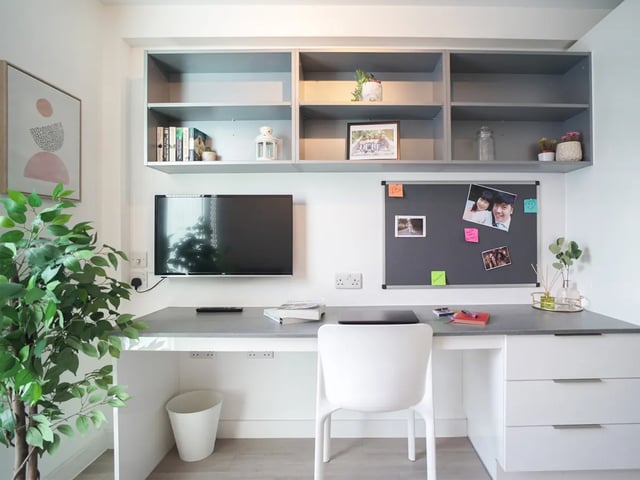 Desk with TV shelves and chair study area at The Recording Rooms in Birmingham Student Accommodation