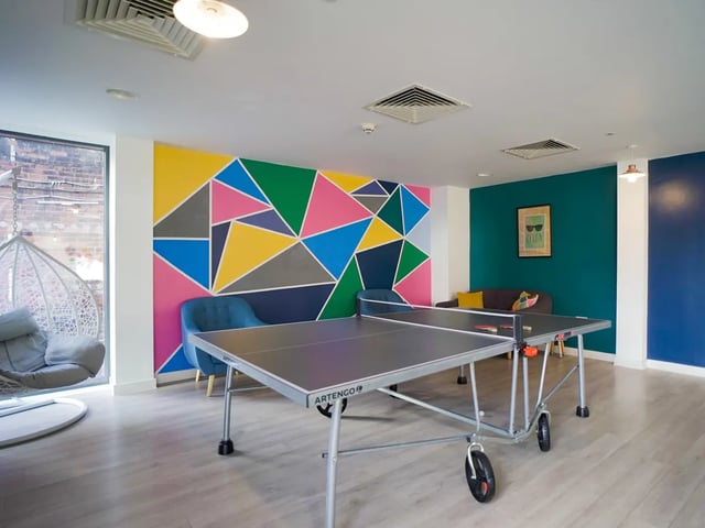Ping pong table seating colorful wall communal area at The Recording Rooms in Birmingham Student Accommodation