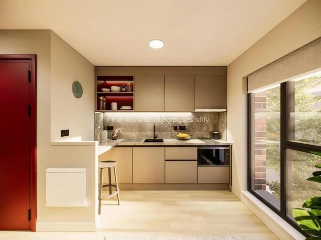 Modern kitchen with sleek cabinets and breakfast bar kitchen at Swan Residences in Glasgow Student Accommodation