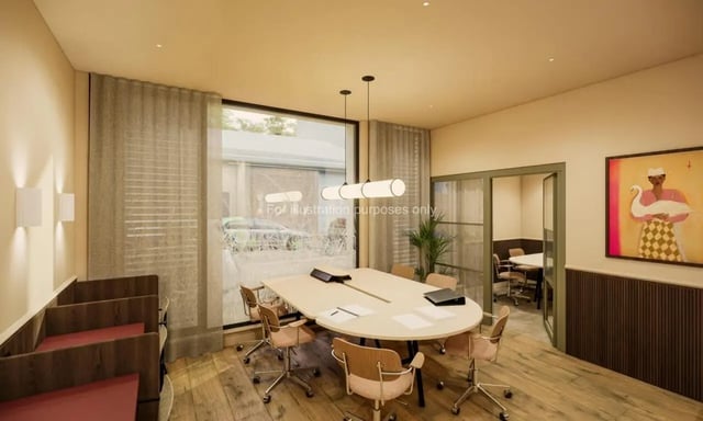 Oval table with chairs and artwork meeting room at Swan Residences in Glasgow Student Accommodation