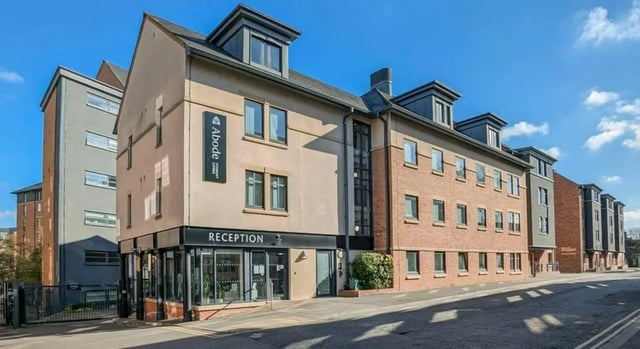 Building with reception sign and windows exterior at Abode York in York Student Accommodation
