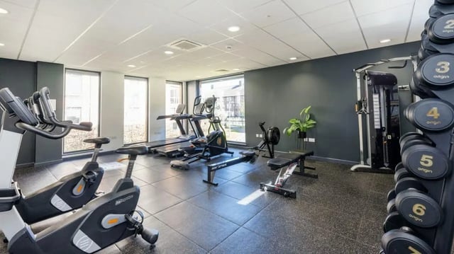 Gym equipment with treadmills and bikes fitness area at Abode York in York Student Accommodation