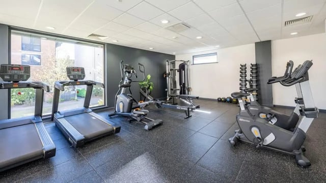 Treadmills rowing machine exercise bikes gym fitness area at Abode York in York Student Accommodation