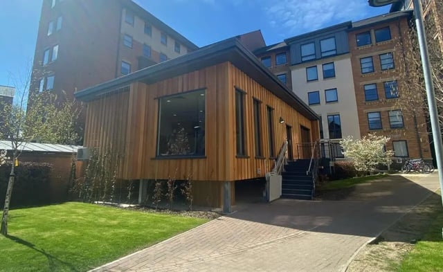 Modern wooden building with stairs exterior at Abode York in York Student Accommodation