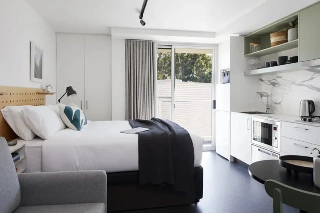 Bed kitchen and table study area at UKO Paddington Village in Sydney Student Accommodation