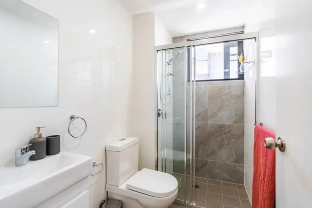 Sink toilet shower and towel Bathroom at UKO Annandale in Sydney Student Accommodation