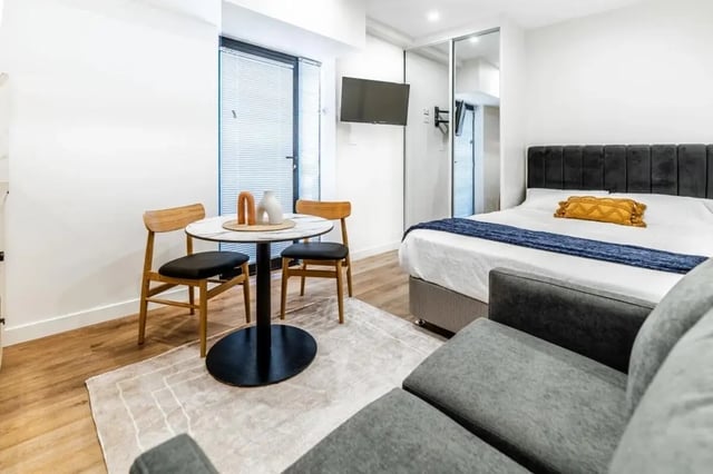 Bed sofa table chairs room interior at UKO Annandale Tower C in Sydney Student Accommodation