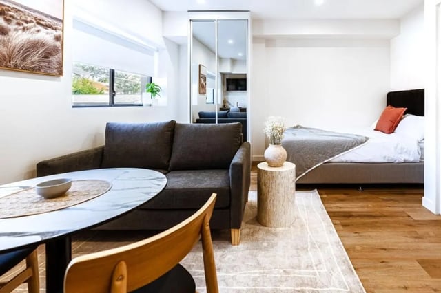 Sofa table bed with decor living room at UKO Annandale Tower C in Sydney Student Accommodation