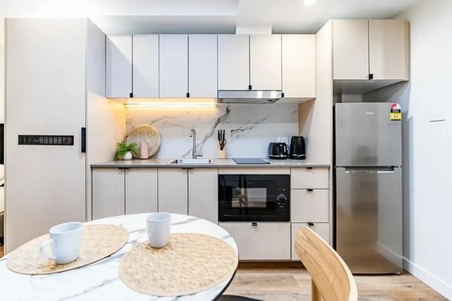 Modern kitchen with microwave fridge sink kettle kitchen at UKO Annandale Tower C in Sydney Student Accommodation