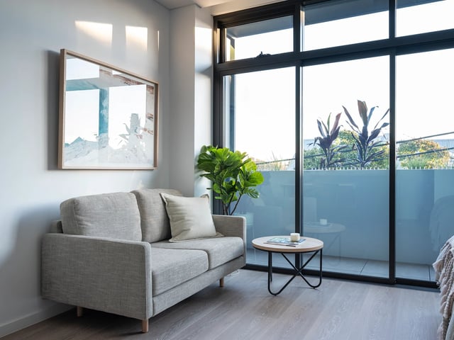 Sofa artwork plants balcony living room at UKO Glebe in Sydney Student Accommodation