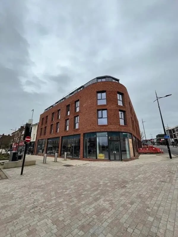Modern brick building with large windows exterior at Cleveland Apartments in Wolverhampton Student Accommodation