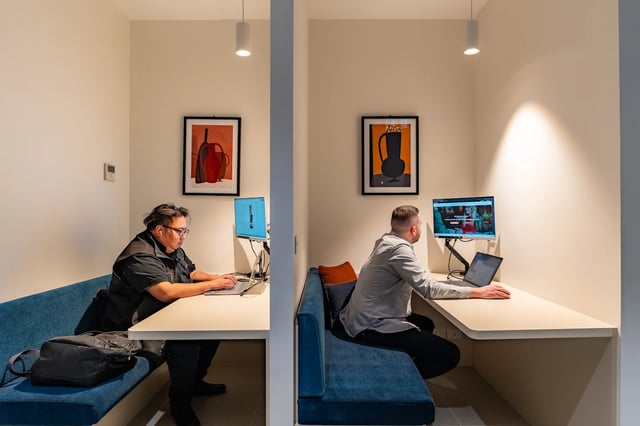 Two men at desks with computers study area at UKO Melbourne Central in Melbourne Student Accommodation