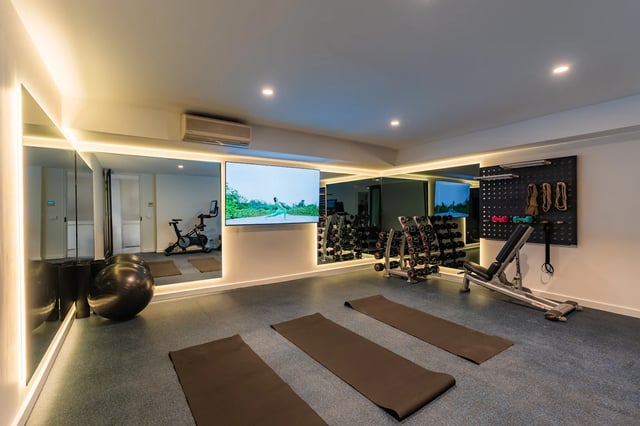 Gym equipment and yoga mats fitness room at UKO Melbourne Central in Melbourne Student Accommodation