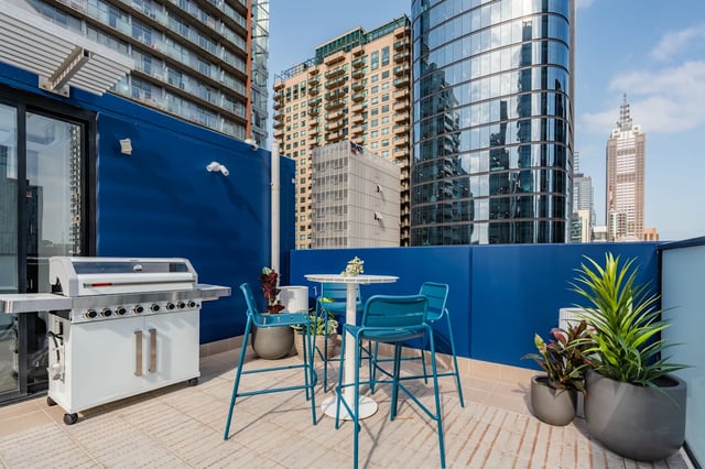 Grill table chairs plants terrace exterior at UKO Melbourne Central in Melbourne Student Accommodation