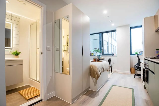 Bed desk and bathroom of studio apartment at Yugo Haüs in Birmingham Student Accommodation