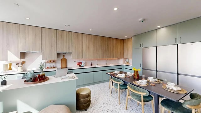 Modern kitchen with dining table and fridges kitchen at Yugo Haüs in Birmingham Student Accommodation