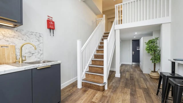 Kitchen sink fire blanket stairs mezzanine hall living room at 26 Great George Street in Leeds Student Accommodation