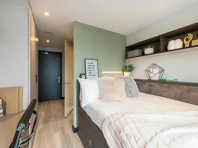 Bed with fluffy pillows and cozy blanket bedroom at Zenith in Cardiff Student Accommodation