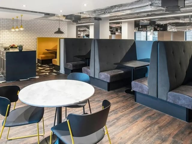 Banquette seating and tables communal area at Zenith in Cardiff Student Accommodation