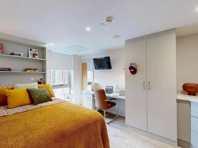 Bed desk television shelves wardrobe bedroom at COSMOS in Sheffield Student Accommodation