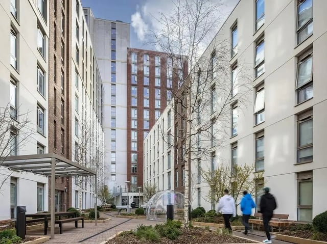 Courtyard with buildings and people exterior at COSMOS in Sheffield Student Accommodation