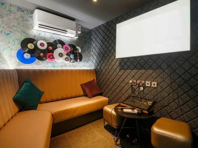 Vinyl records sofa television karaoke setup living room at COSMOS in Sheffield Student Accommodation