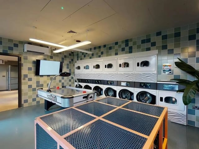 Air hockey table and washers utility area at COSMOS in Sheffield Student Accommodation